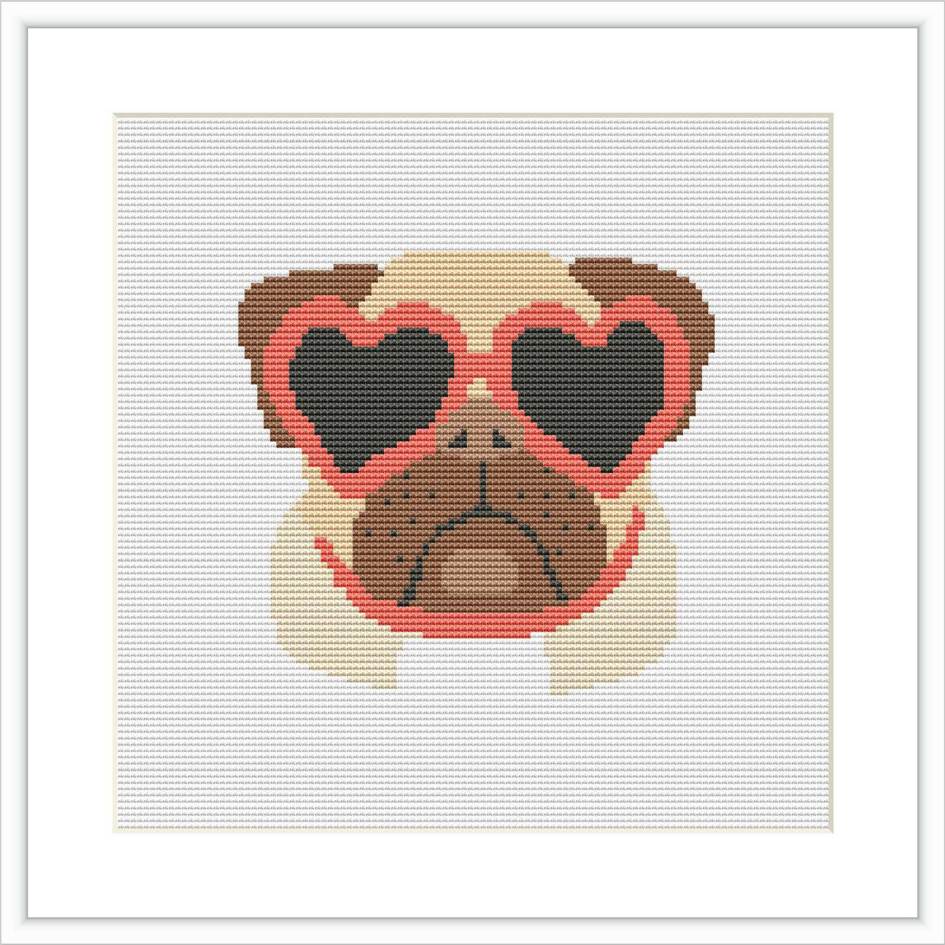 The image displays a cross stitch pattern featuring a pug with heart-shaped sunglasses. The pattern has a white border around it, suggesting it's framed or mounted.