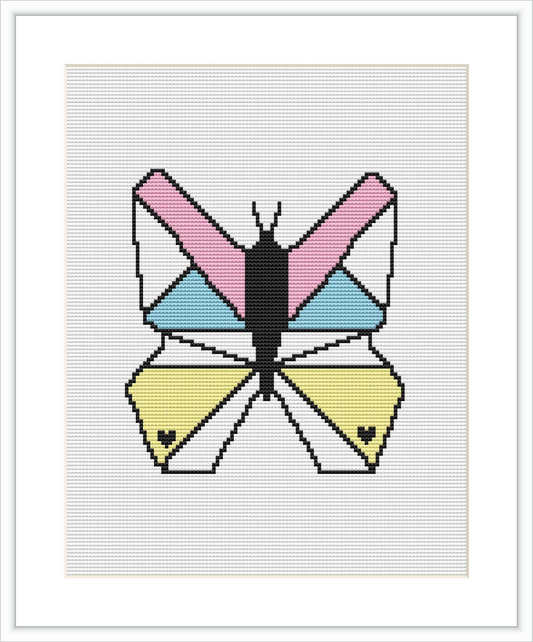 The image displays a cross-stitch pattern featuring a stylized butterfly with geometric patterns and distinct color blocks in shades of pink, blue, yellow, and black, centered on a white canvas.