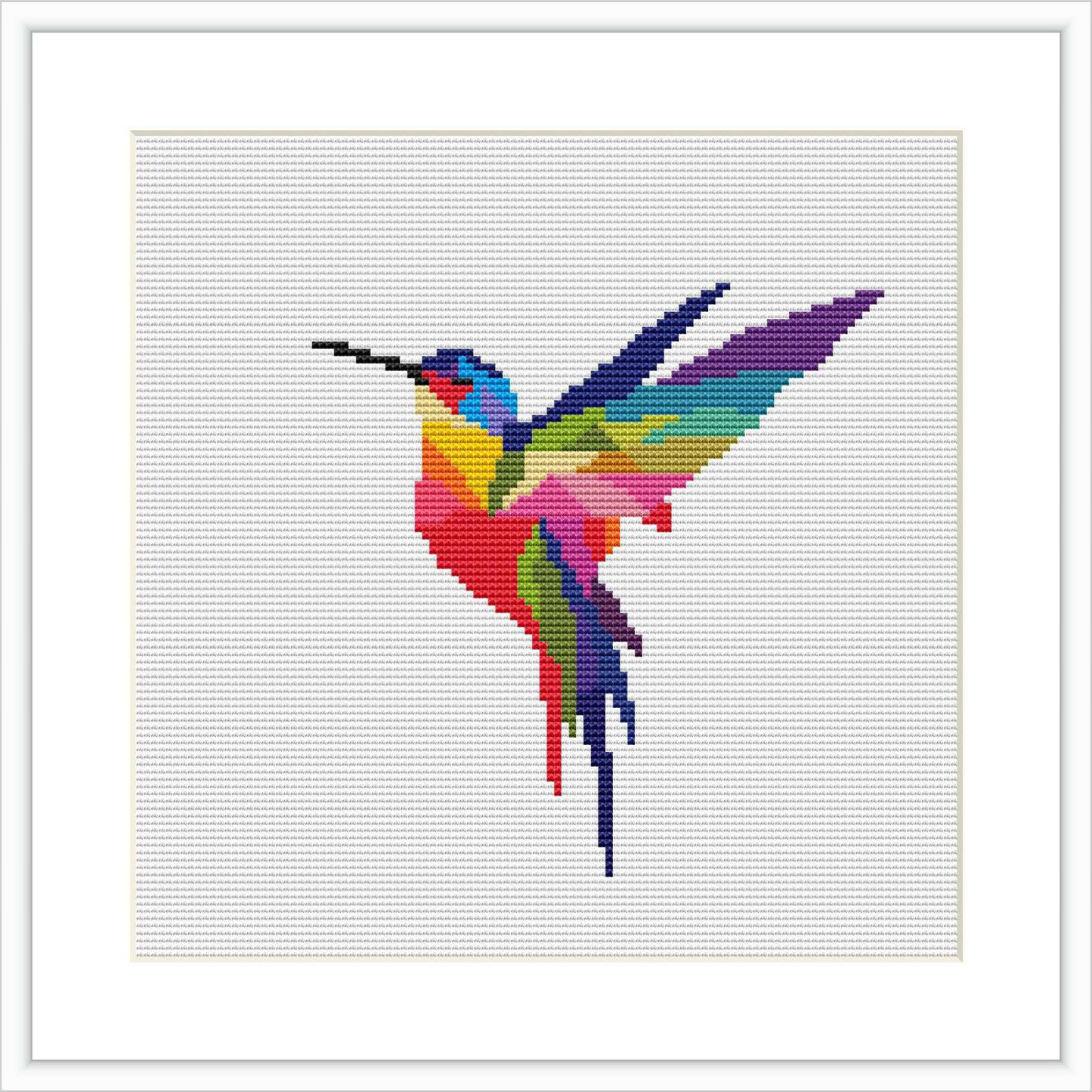 The image displays a cross stitch pattern of a hummingbird in mid-flight with wings spread. The bird is depicted in a colorful, pixel art style against a white background in a square frame.