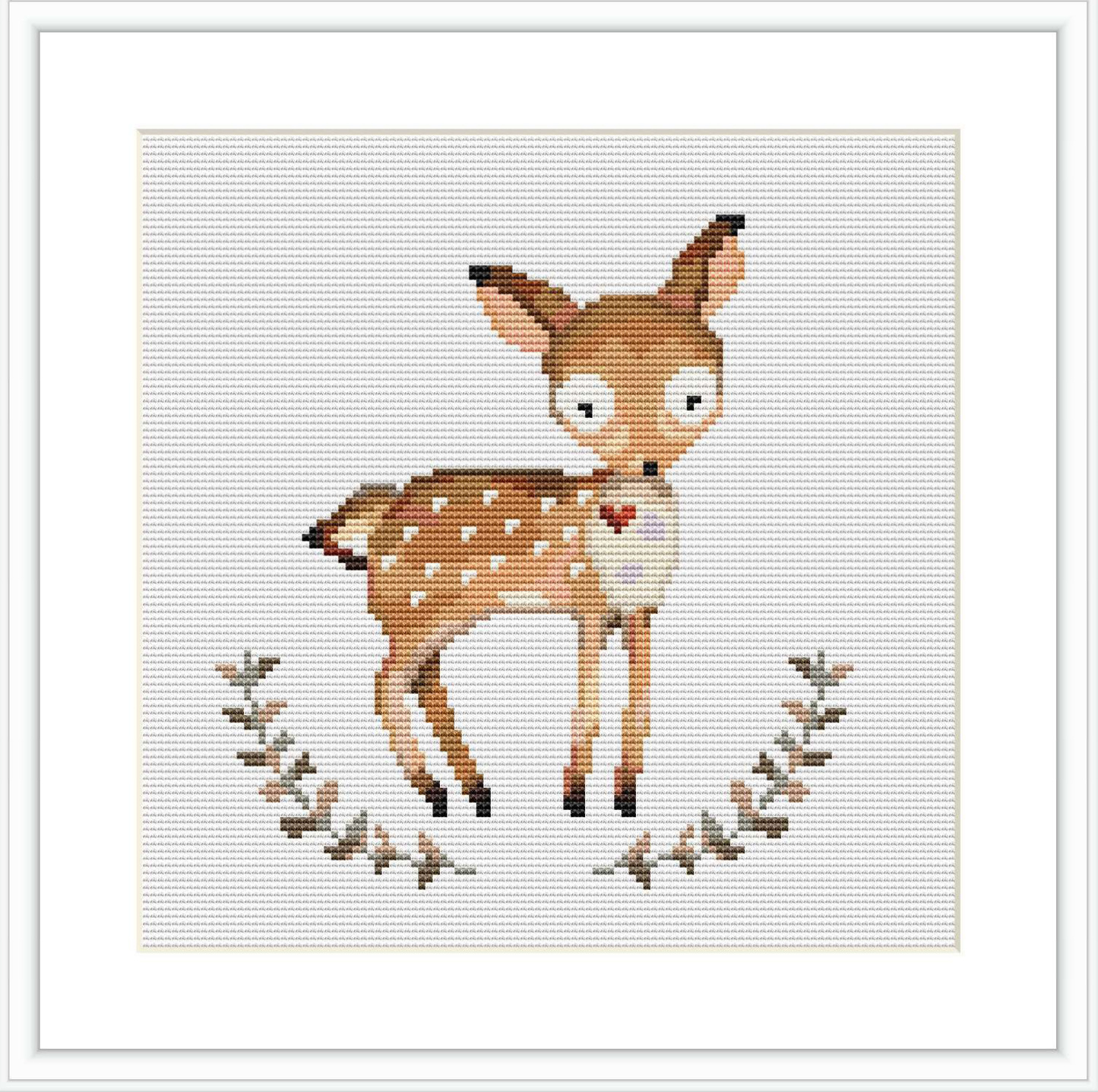 The image features a cross stitch pattern with a central figure of a deer surrounded by a circular wreath of leaves, all stitched onto a plain white background.