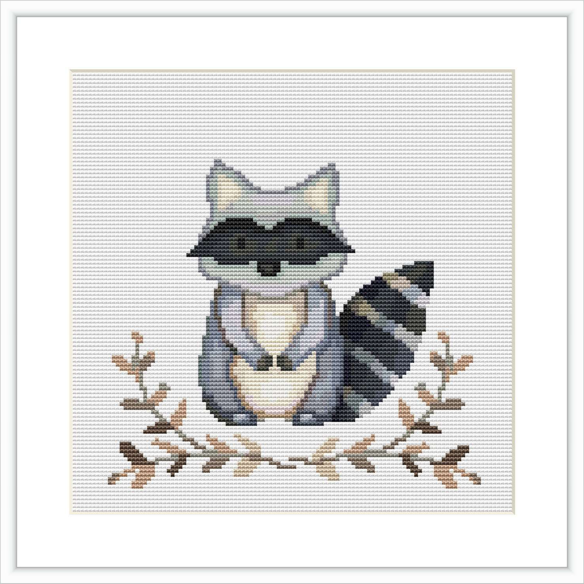 The image shows a framed cross stitch pattern featuring a raccoon with leaves around it. The raccoon is centered on the fabric, surrounded by a simple border and a white background space.