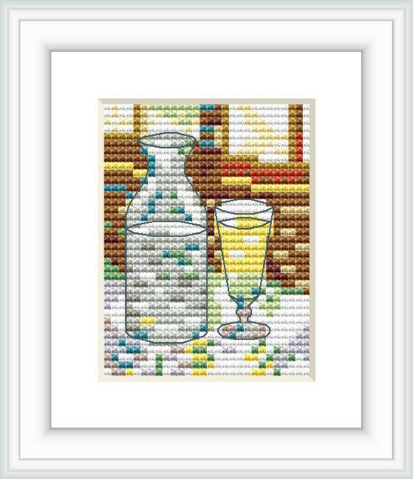 The cross-stitch pattern depicts a carafe and a glass on a table, mimicking the style of Van Gogh's painting 'Still Life with Absinthe'.