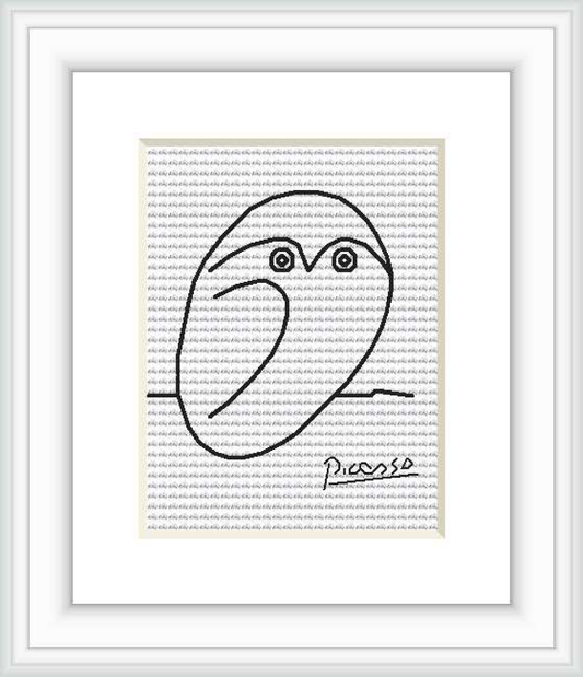 The image shows a framed cross stitch pattern depicting a minimalist outline of an owl, attributed to the style of Pablo Picasso. It features a simple contour drawing of the owl with a signature at the bottom right.