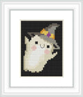 The image shows a framed cross stitch embroidery of a stylized ghost figure with a small crown on its head. The embroidery is made of small, precise stitches with varying shades to create depth and detail.