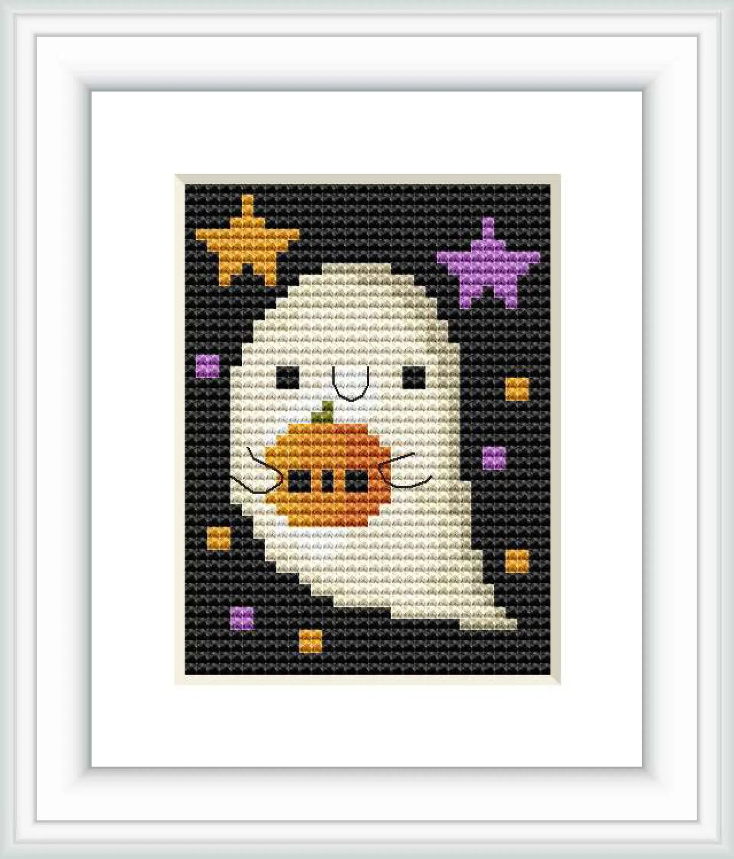 The cross stitch design depicts a white ghost centered on a black background, with purple and yellow stars, and orange and yellow squares scattered around it.