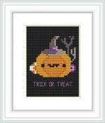 The image displays a cross stitch pattern with a stylized pumpkin ghost wearing a witch's hat against a black background, with the caption 'TRICK OR TREAT' at the bottom.