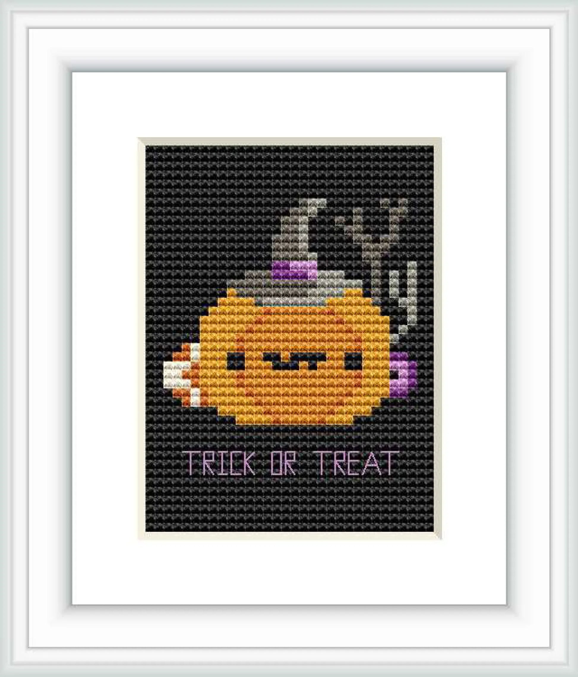 The image displays a cross stitch pattern with a stylized pumpkin ghost wearing a witch's hat against a black background, with the caption 'TRICK OR TREAT' at the bottom.