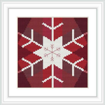 The image shows a cross stitch pattern featuring a central white snowflake on a red background, bordered by a thin white frame.