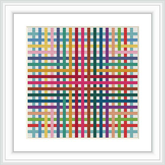 The image features a framed cross stitch pattern displaying a colorful, geometric design with a symmetrical layout of shapes in a grid-like pattern.