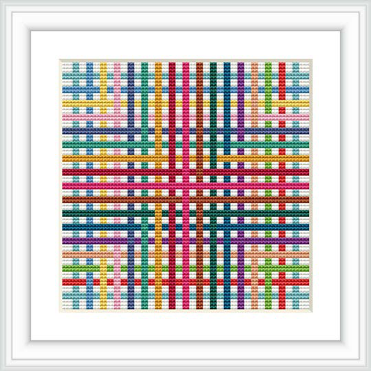 The image features a framed cross stitch pattern displaying a colorful, geometric design with a symmetrical layout of shapes in a grid-like pattern.