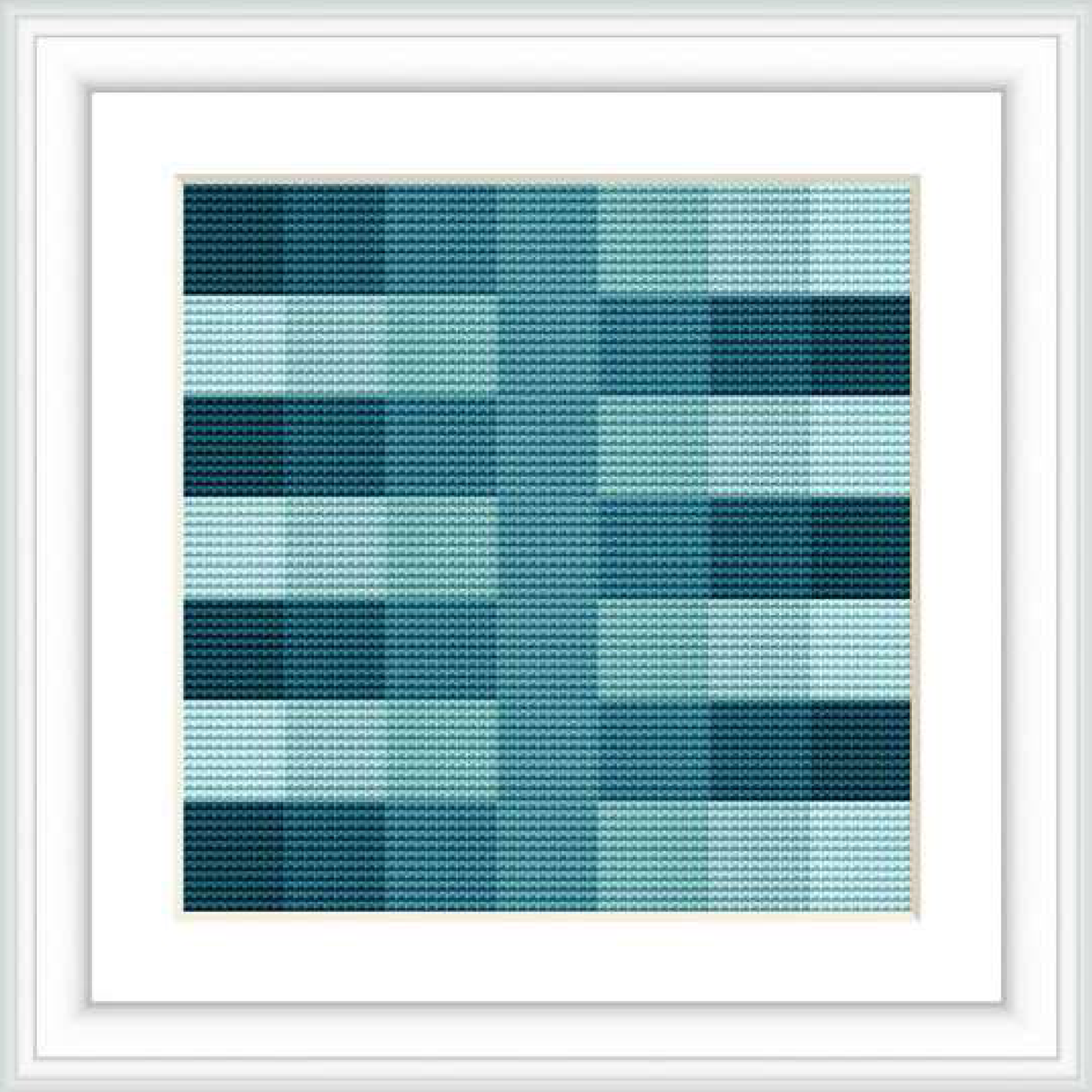 This is a framed image of a cross stitch pattern design. The design features a geometric pattern with varying shades of blue and squares aligned in a grid. The gradients form a pixelated effect.