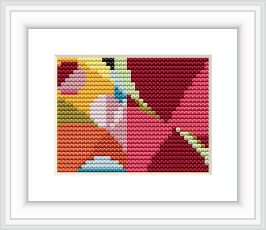 A framed cross stitch pattern resembling an abstract geometric design, consisting of multiple lines and color blocks, placed against a white background showcasing the design's vibrant colors.