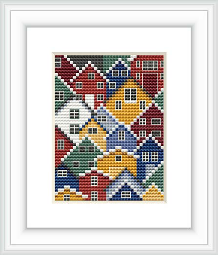 The image showcases a cross stitch pattern depicting a tightly-knit arrangement of stylized houses in a variety of colors nested closely together, emulating a Nordic village.