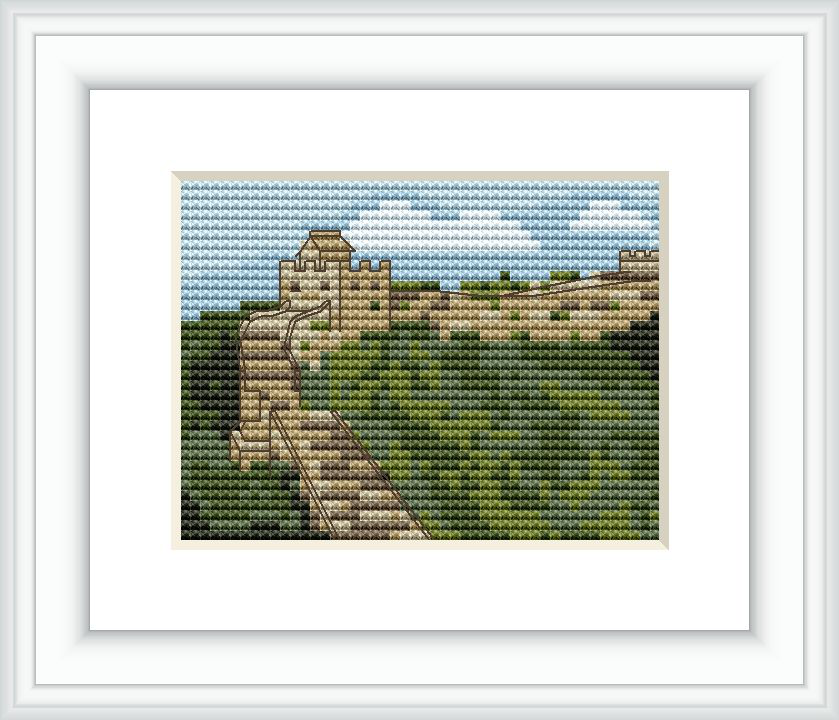 The cross stitch pattern depicts the Great Wall of China winding through a natural landscape with trees and clear skies.