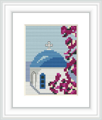 The image depicts a cross stitch pattern portraying a white building with a classic Santorini blue dome and a cross at the top. To the right, there is a branch with pink bougainvillea flowers. The background suggests a clear sky.