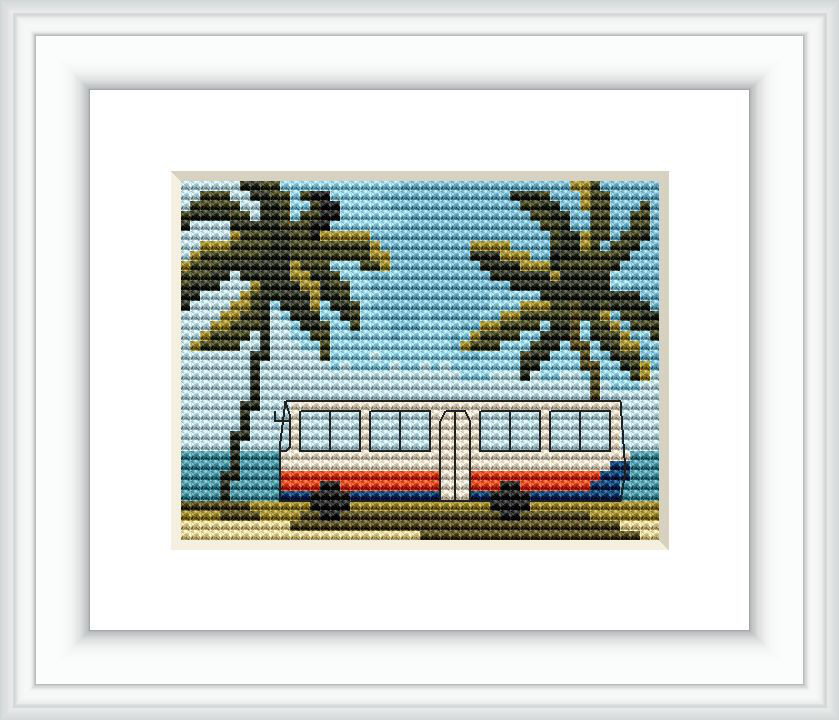 The image depicts a framed cross stitch pattern featuring a red and white train with blue accents, set against a backdrop of palm trees under a sky blue background.