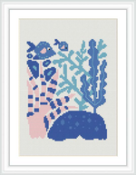 The image showcases a cross-stitch pattern of an underwater scene with various fish, coral formations, and seabed represented in a stylized format.