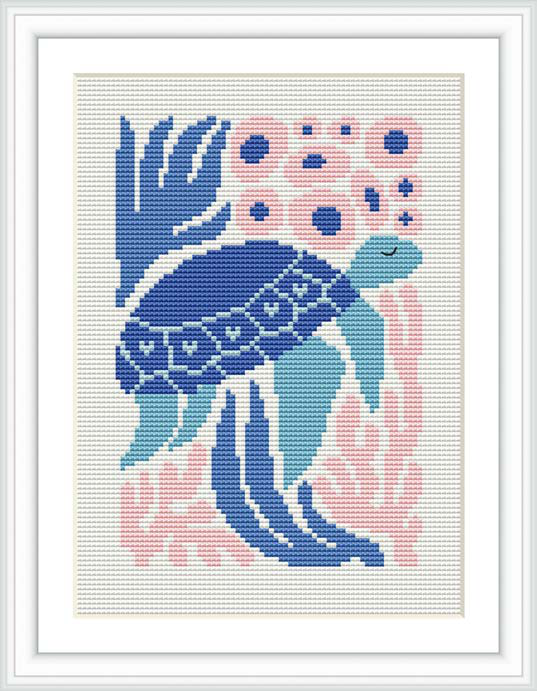 The image depicts a framed cross-stitch pattern featuring a stylized turtle swimming among coral-like structures, primarily in shades of blue and pink, against an off-white background.