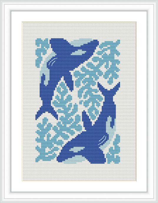 A cross stitch pattern featuring a killer whale in a silhouette style, with aquatic floral patterns filling its form. The design is set against a plain light background and framed.