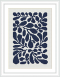 The image depicts a framed cross stitch design featuring a monochromatic floral pattern in various shades of blue, set against a white fabric background.