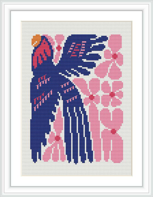 The image shows a cross stitch pattern featuring two stylized birds facing each other with a backdrop of what appears to be a plant or floral motif. The birds are predominantly navy blue with pink and orange accents, stitched against a white fabric background inside a square frame.