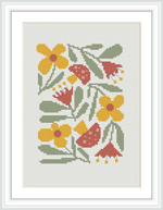 The image shows a cross stitch pattern framed and displayed on a wall. It consists of a variety of flowers with different shapes and colors, predominantly yellow and red, with green leaves, stitched on a white fabric background.
