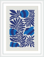 The image shows a framed cross stitch pattern of stylized blue flowers and leaves on a white canvas, executed in various shades of blue and white thread.