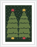 The image displays a framed cross stitch pattern showing two green Christmas trees with star-shaped toppers and colorful ornaments, set against a dark blue background with white snowflakes.