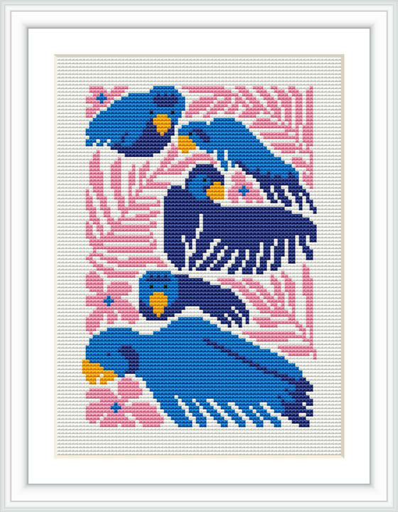 The image displays an intricately stitched design featuring three stylized bluebirds with navy and white detailing, set against a patterned pink background with floral elements and yellow accents, all within a bordered canvas framed in white.