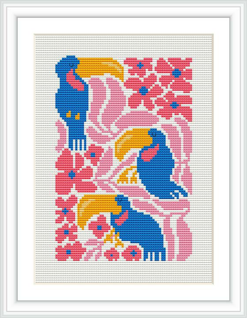 The image shows a framed cross stitch piece featuring a whimsical bird in stylized form with bold colors such as blue and pink, surrounded by floral motifs. The bird appears to be in a serene pose, with the design set against a white background.