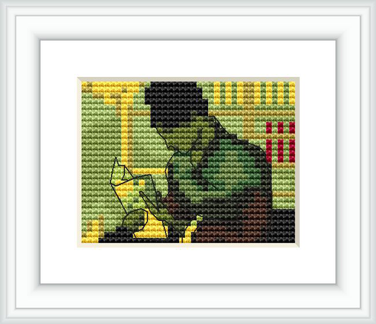 The image features a cross stitch pattern of a person sitting and reading a book in a silhouette style, with earthy tones in the background and a few brighter accents.