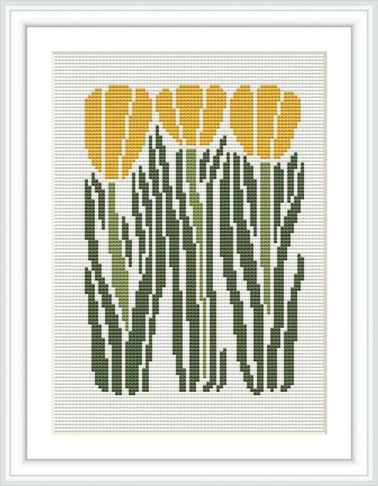 The image depicts a cross stitch pattern of a group of yellow tulips with green leaves and stems, framed within a white border and set against a cream or light background.