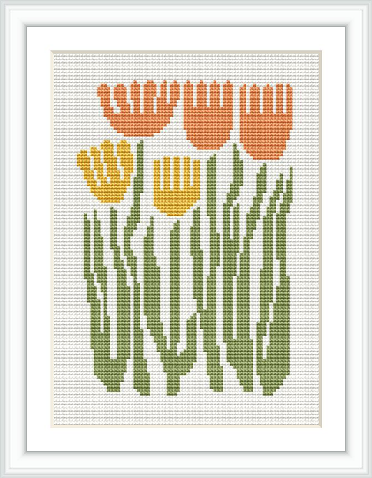 The image shows a cross stitch pattern depicting five tulips in orange and yellow colors with green stems and leaves, framed and displayed against a white aida cloth.