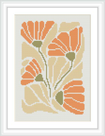 The image shows a framed cross stitch pattern with a design of orange flowers, accented by green leaves and stems, against a cream-colored background.