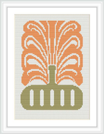 The image displays a cross-stitch pattern of an ornamental vase with a symmetric floral design. It is executed in warm colors, predominantly orange, with green accents for the vase.