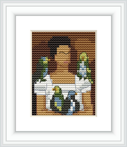 A cross stitch pattern depicting a stylized version of artist Frida Kahlo in a self-portrait with two colorful parrots on her shoulders against a brown background.