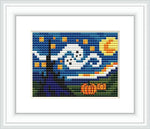 The image shows a framed cross-stitch pattern featuring a Halloween-themed adaption of Van Gogh's 'Starry Night'. There are pumpkins at the foreground, a swirling night sky filled with stars, and a crescent moon in the background.