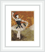 The image displays a framed cross stitch pattern depicting a ballet dancer with a tambourine. The dancer is in a dynamic pose and set against a backdrop of warm-toned impressionistic pixelation.