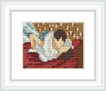 The cross stitch design is a pixelated representation of two figures in an embrace, lying together in what appears to be a bed. The surroundings suggest an intimate indoor setting.