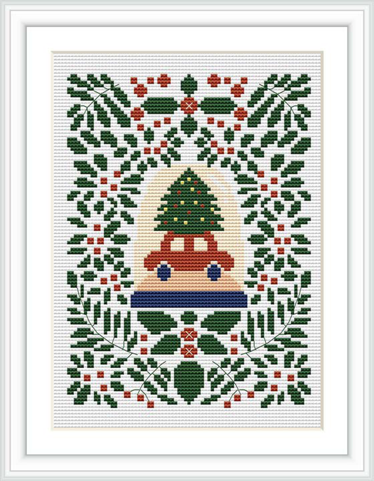 The image shows a cross stitch pattern featuring a central design of a vintage car with a Christmas tree on top, surrounded by a decorative border composed of geometric shapes and Christmas foliage.