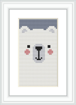 The image showcases a framed cross stitch pattern featuring a stylized bear face with a simple and clean look, centered on a white background within a black frame.