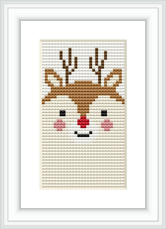 The image displays a framed cross stitch pattern of a stylized deer face with antlers. The design is centered on a light background fabric, positioned within a minimalist white frame.