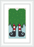 The image presents a cross-stitch pattern featuring the bottom half of two gnomes against a blue and green background, showcasing their iconic red conical hats and black boots.