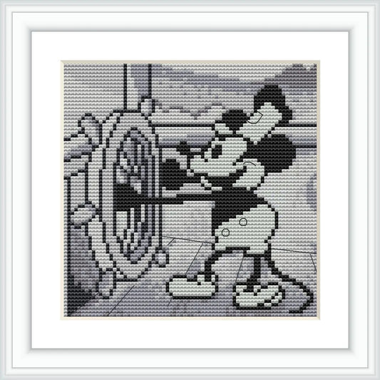 The image depicts a cross stitch pattern framed in white, showing a classic animated character holding the steering wheel of a ship. The character is facing left, wearing gloves, and is designed in grayscale against a lighter background.