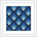 The image shows a framed cross stitch pattern featuring a geometric diamond design. The diamonds are arranged in a grid, varying in shades of blue, and are contained within a white square frame.