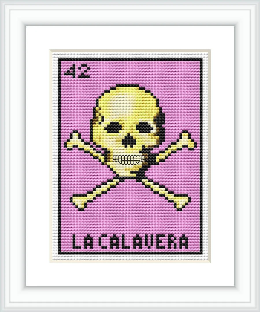 The image shows a cross stitch pattern resembling 'La Calavera' from the Mexican 'Lotería' game. It features a skull centered above crossbones, against a lavender background, with the number '42' at the top and the inscription 'LA CALAVERA' at the bottom, all within a white picture frame.