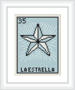 A cross stitch pattern framing a star shape in the center with 'LA ESTRELLA' text beneath it, surrounded by pale blue background and light borders. The number 35 is printed at the top.