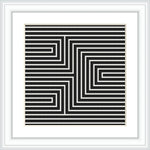 A framed cross stitch pattern with a black and white geometric arrow design creating an optical illusion, mounted on a wall or placed on a flat surface.