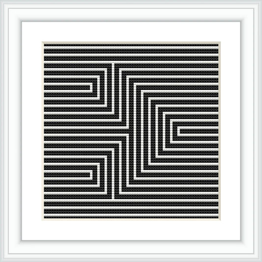 A framed cross stitch pattern with a black and white geometric arrow design creating an optical illusion, mounted on a wall or placed on a flat surface.